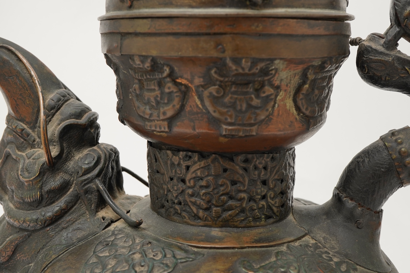 A large Tibetan repoussé brass and copper ewer, 19th century